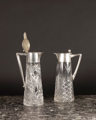 Deux pichets en cristal taillé et montures...