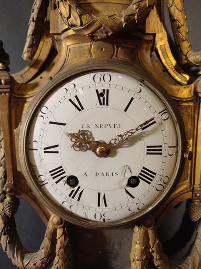 Gilt bronze wall clock decorated with an...