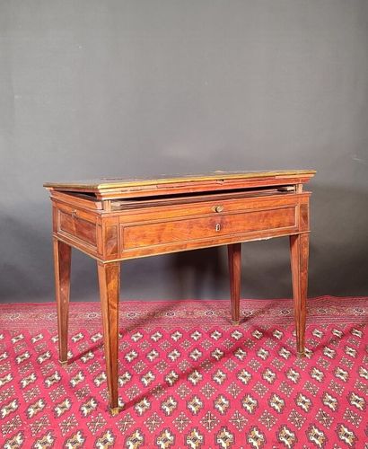 Mahogany and mahogany veneer table with ebony...