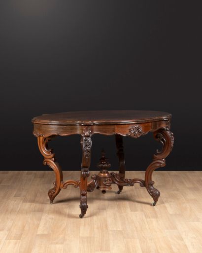 Carved and molded rosewood middle table with...