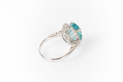 White gold ring set with a natural oval apatite...