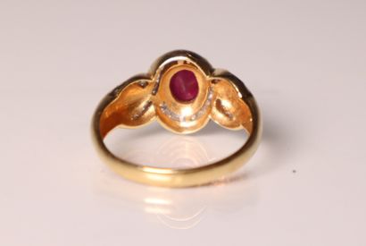 Yellow gold ring with a ruby and small diamonds...