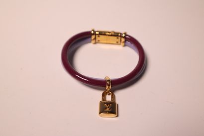 LOUIS VUITTON. Bracelet en métal doré à 2...