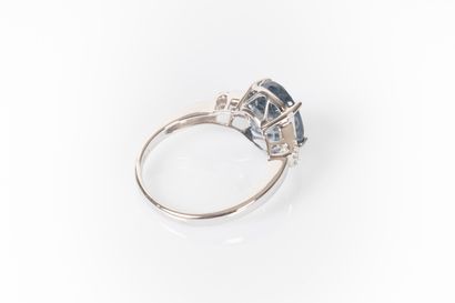 White gold ring set with a natural oval sapphire...