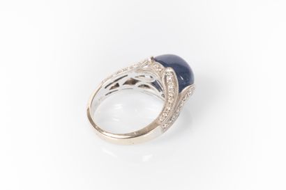 White gold ring set with an oval Burmese...