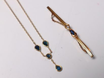 Gold brooch and necklace set with small sapphires....