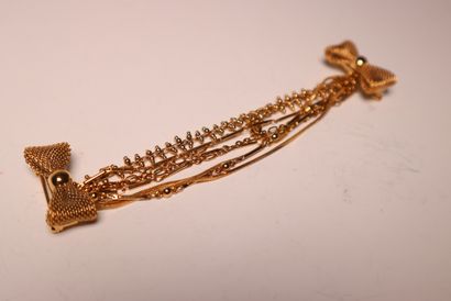 LOUIS VUITTON. Broche en métal doré. Boî...