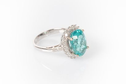 White gold ring set with a natural oval apatite...