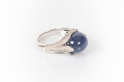 White gold ring set with an oval Burmese...