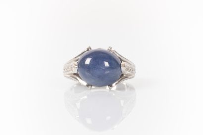 White gold ring set with an oval Burmese...