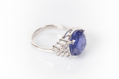 White gold ring set with a round tanzanite...