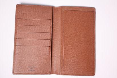 LOUIS VUITTON. Portefeuille en toile monogrammée....