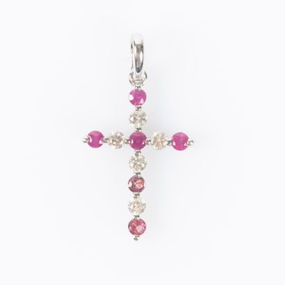 Croix en or blanc 750°/.(18K) 0g55 sertie...