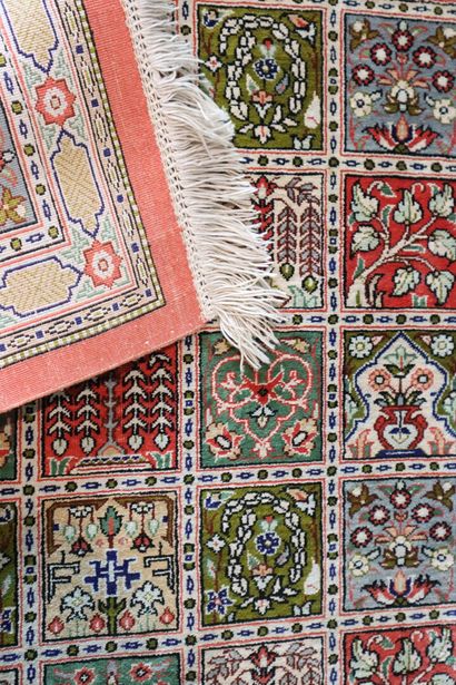 Wool and silk carpet decorated with stylized...