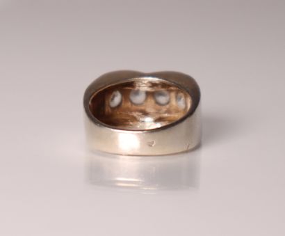 White gold ring set with 4 white stones....
