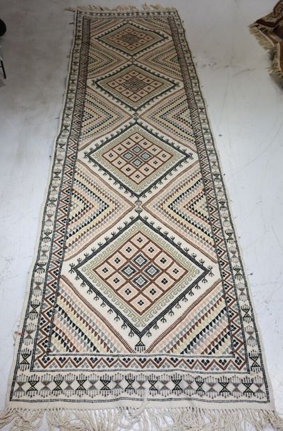 TUNISIA. Wool carpet with beige background...