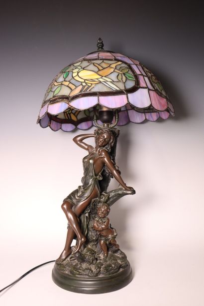 Lamp decorated with a woman and child, in...