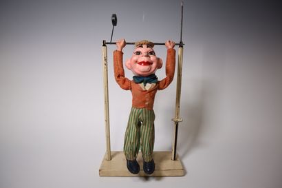 Paper maché acrobat clown and pendulum. Height:...