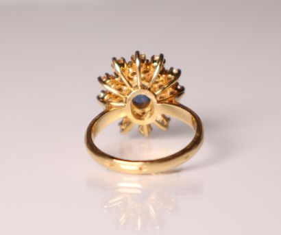 Yellow gold daisy ring set with a sapphire...