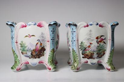 Pair of earthenware pot covers decorated...