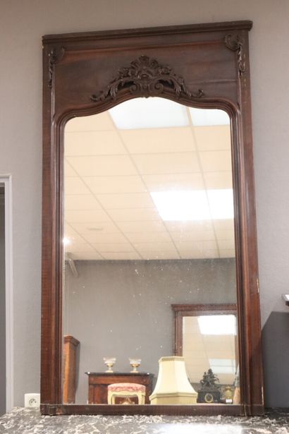 Large pedimented mirror in carved natural...