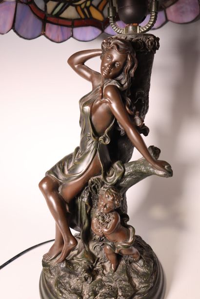 Lamp decorated with a woman and child, in...
