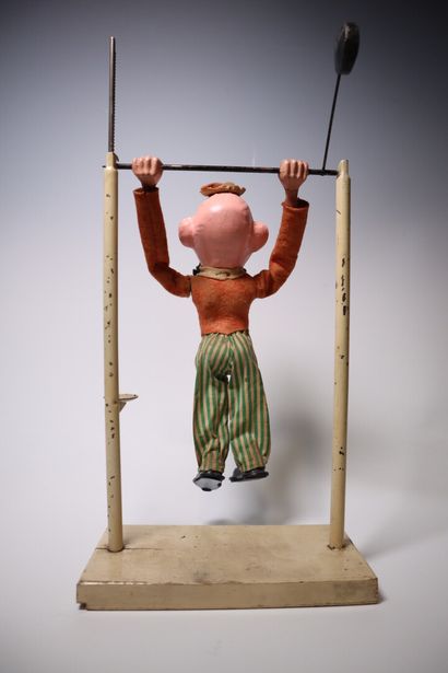 Paper maché acrobat clown and pendulum. Height:...