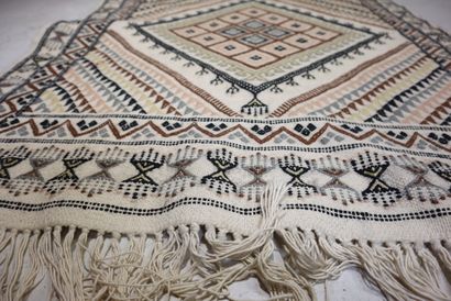 TUNISIA. Wool carpet with beige background...