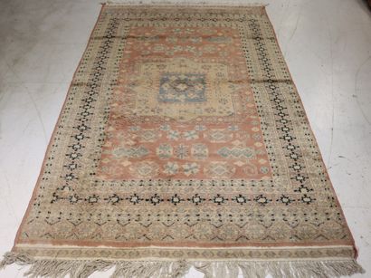Oriental wool carpet with pink background....