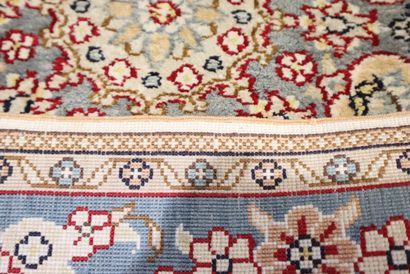 Oriental silk carpet with ecru background....