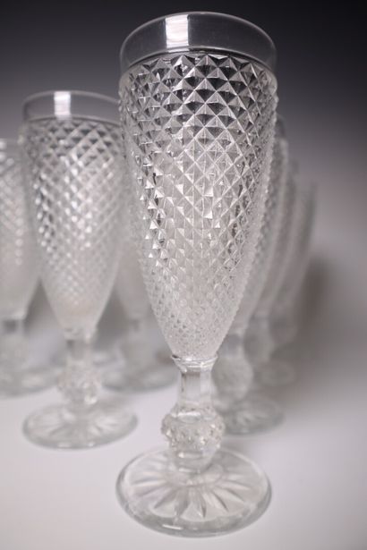 Set of ten molded crystal champagne flutes,...