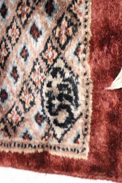 Wool carpet with brown background. 295 x...