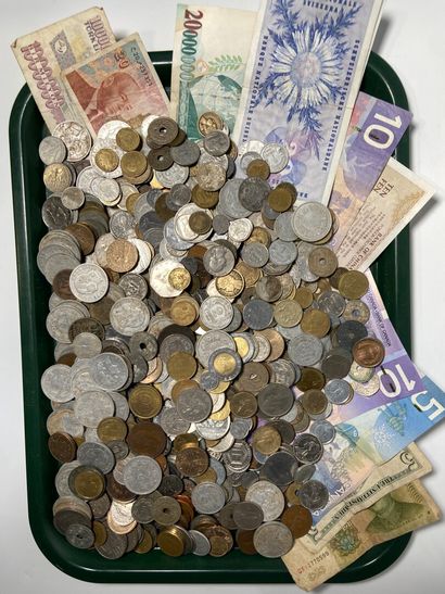 Set of banknotes and coins, some in silv...