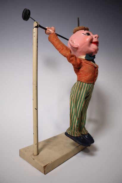 Paper maché acrobat clown and pendulum. Height:...