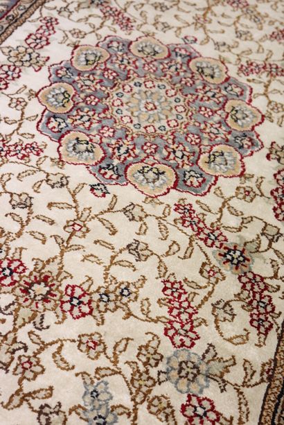 Oriental silk carpet with ecru background....