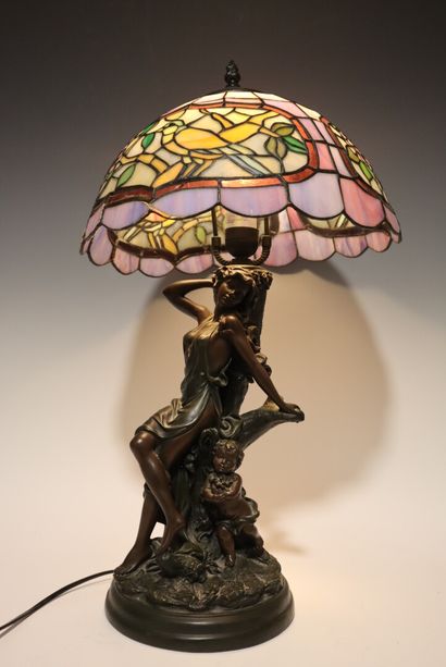 Lamp decorated with a woman and child, in...