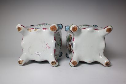 Pair of earthenware pot covers decorated...