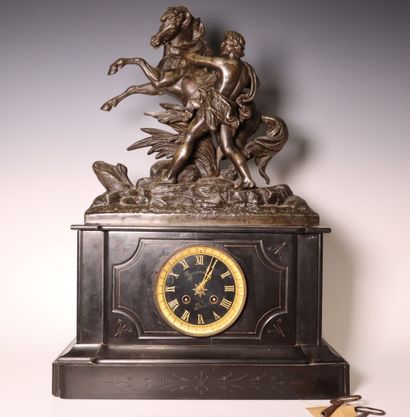 Black marble clock, subject in composition...