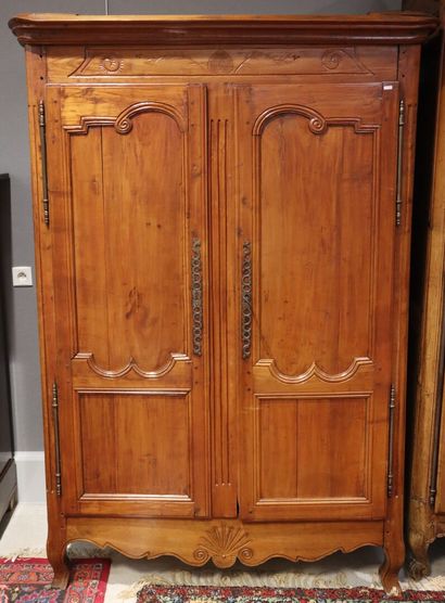 Natural wood cabinet opening with 2 doors....