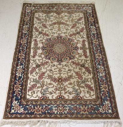 Oriental silk carpet with ecru background....