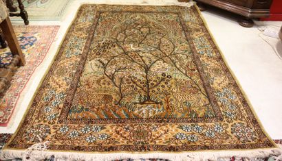 * Oriental silk carpet with beige background...