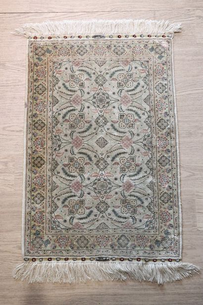 Wool and silk carpet with beige background...