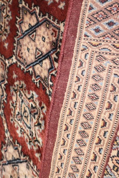 Wool carpet with brown background. 295 x...