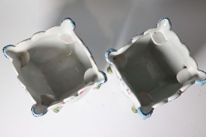 Pair of earthenware pot covers decorated...