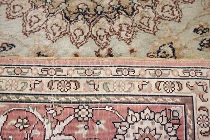 KAYSERI Oriental silk carpet with beige background....