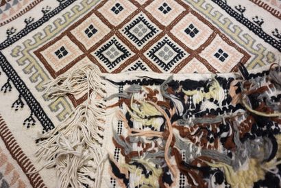 TUNISIA. Wool carpet with beige background...