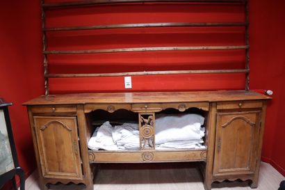 Low sideboard in natural wood opening with...