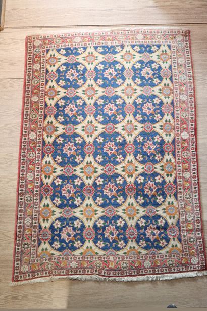 Wool carpet with beige background and flower...