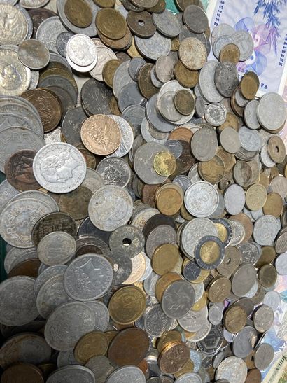 Set of banknotes and coins, some in silv...