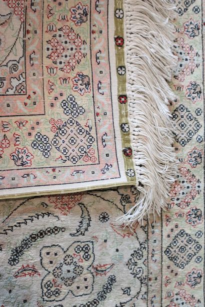 Wool and silk carpet with beige background...